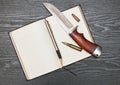 Knife and notebook Royalty Free Stock Photo