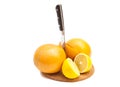 Knife with orange and lemons Royalty Free Stock Photo