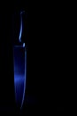 A knife in cold blue light