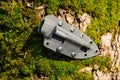 Knife with the plastic kydex sheath in the forest background Royalty Free Stock Photo