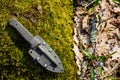 Knife with the plastic kydex sheath in the forest background Royalty Free Stock Photo