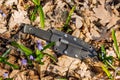 Knife with the plastic kydex sheath in the forest background