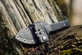 Knife with the plastic kydex sheath in the forest background Royalty Free Stock Photo