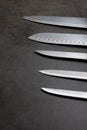 Knife set on a dark gray table Royalty Free Stock Photo