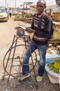 Knife sharpener on a Nairobi suburb market in Kenya