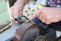 Knife sharpener sharpens a knife Royalty Free Stock Photo