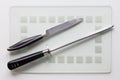 Knife and sharpener on the white background Royalty Free Stock Photo