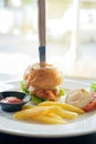 Knife stabbed on fried chicken hamburger