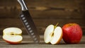 Knife. Stainless steel knife, apple. Fruit Diet. Chef or butcher knife. Professional equipment on kitchen Royalty Free Stock Photo