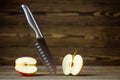 Knife. Stainless steel knife, apple. Chef or butcher knife. Professional equipment on kitchen. Knife for slice fruit Royalty Free Stock Photo