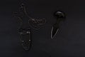 A knife with two blades. Military composition on a black background. Royalty Free Stock Photo