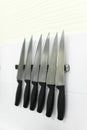 Knifes set on kitchen wall Royalty Free Stock Photo