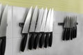 Knifes set on kitchen wall Royalty Free Stock Photo