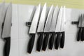 Knifes set on kitchen wall Royalty Free Stock Photo