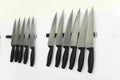 Knifes set on kitchen wall Royalty Free Stock Photo