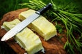 knifes slicing through grass-fed butter stick