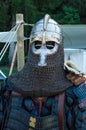 Knight armor on display with shield and weapons