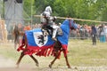 Knight in armor on a horse.