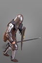 Knight in breaths in a helmet with a sword and shield in battle over grey background Royalty Free Stock Photo