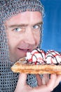 Knight eating waffle with ice-cream Royalty Free Stock Photo