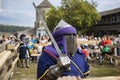 Knight festival historical reconstruction event man in Eastern armor and sword in paddock space for battles Royalty Free Stock Photo