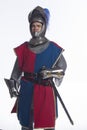 Knight in full armor with shield and sword, vertical