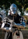 knight full plate medieval armor posing in front of the camera