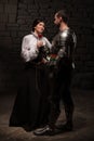 Knight giving a rose to lady Royalty Free Stock Photo