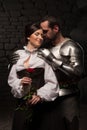 Knight giving a rose to lady Royalty Free Stock Photo