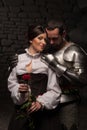 Knight giving a rose to lady Royalty Free Stock Photo