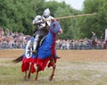 Knight in heavy armor on a horse and with a lance Royalty Free Stock Photo