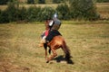 Knight on horse. Medieval armored equestrian soldier. Rider is in the summer