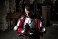 Knight Kneeling On His Knees With Bowed Head And Praying Hands