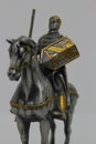 Statue of a medieval mounted knight in armour on White background