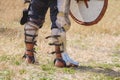 Knight`s legs in combat armor. The knight waits for the start of the battle_