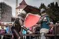 Knight tournament. The knights in the congregations are fighting in the ring. Public event in the city. Royalty Free Stock Photo