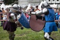 Knight tournament. The knights in the congregations are fighting in the ring. Public event in the city. Royalty Free Stock Photo