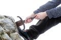 Knight tries to remove Excalibur sword in the stone Royalty Free Stock Photo