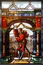 Knight with weapon in the colored stained glass of the interior of Peles Castle in Romania