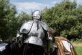 Knight wearing suit of armour read for jousting