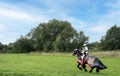 Knight wearing suit of armour read for jousting