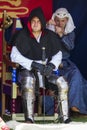 Knight and woman sitting in tent. Medieval Display. Warkworth, Northumberland. England. UK.