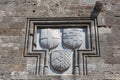 Knightly coat of arms on the wall of a house in Rhodes. Royalty Free Stock Photo