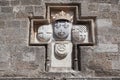 Knightly coat of arms on the wall of a house in Rhodes. Royalty Free Stock Photo