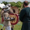 Knights in Battle with Silver Helmets and Armors