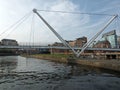 Knights bridge crossing the river aire in leeds with surrounding riverside apartments Royalty Free Stock Photo