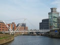 knights bridge crossing the river aire in leeds with surrounding riverside apartments and royal armouries