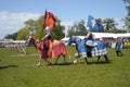 Knights on horses with banners and dress at a show in Ireland stallion donkey pony Clydesdale Royalty Free Stock Photo