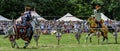 Knights joust in front of an excited crowd Royalty Free Stock Photo