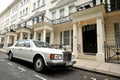Knightsbridge residential and retail district in central Londonand a luxury Rolls Royce car as a wealthy status symbol